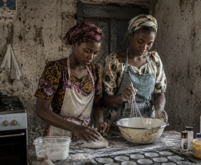 Girls baking together at the Lives Transformed skills center in Nigeria.